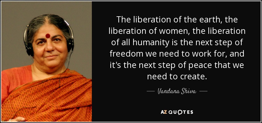 graphic text image of Vandana Shiva quote: The liberation of the earth, the liberation of women, the liberation of all humanity is the next step of freedom we need to work for, and it's the next step of peace that we need to create., with close-up portrait of her to the left of text